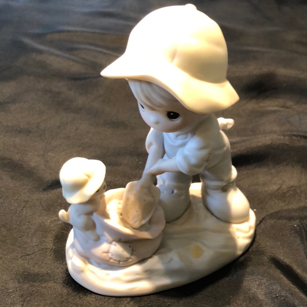 Precious Moments~~~NOTHING CAN DAMPEN THE SPIRIT OF CARING.    PRICE REDUCED